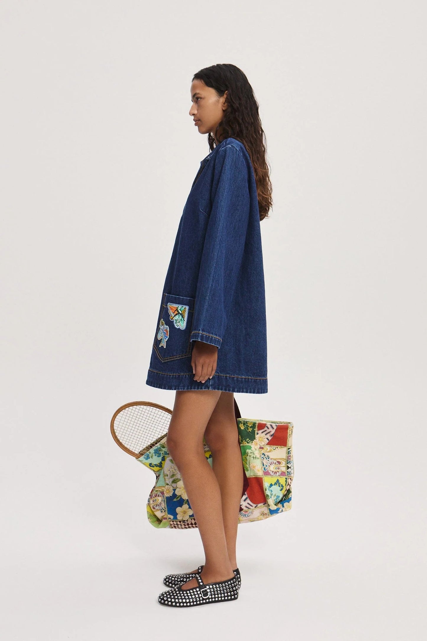 Side view of Speedy embroidered cotton denim mini dress by Alémais