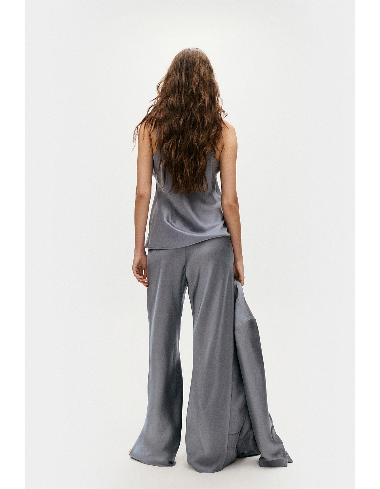 Back view of glossy silk bias cut pant by Silk Laundry with elasticated waistband